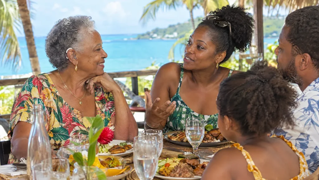 Repas en famille sur une terrasse de restaurant en bord de mer en Guadeloupe